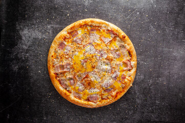 Pizza on a gray dark background top view