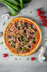 Pizza with mushrooms and cheese on a light gray background