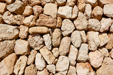 Natural stone textured wall background. Solid outdoor construction