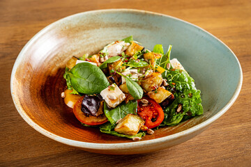 greek salad on the wooden background