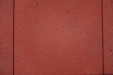 Fototapeta premium Close view of brownish red EPDM synthetic rubber floor