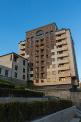 Beautiful apartment building lined with traditional stone in Yerevan. Armenia 