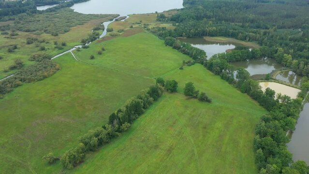 Fishpond system fish hatchery hatcheries Trebonsko biosphere UNESCO reserve protected landscape area wetlands pond Rozmberk cages fishing Czech largest biggest meadows Trebon, drone aerial video shot