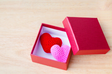 Special Gift open box with Heart Knitting inside box for decoration on background. Concept of love and greeting card valentine day for add text message.