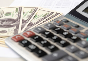 Money dollars and calculator, economy concept, money distribution. Euro. The crisis after the covid-19 pandemic. The dollar is falling or rising.