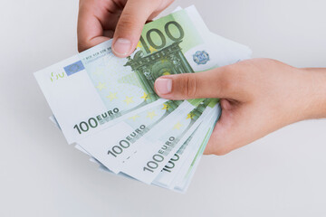 Man counting money, economy concept, allocation of money.Crisis after the covid-19 epidemic .Euro falling or rising.