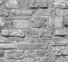 Old castle stone wall. Grunge close up background texture in gray colors.