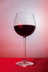 glass of red wine on a velvet bar counter