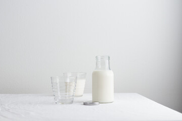 Fresh Milk on the table with white tablecloth