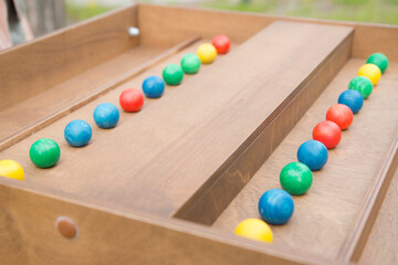 Chess-like game with colorful wooden balls