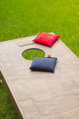 Cornhole bags on a board close up