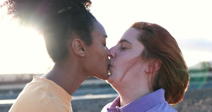 Multiracial lesbian couple having tender moment together outdoor - Homosexual love