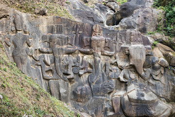 Unakoti, India - January 23 2022: Famous Rock sculpture of Unakoti. The sculptures are made in the...
