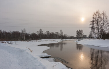 The February river reflects the sun