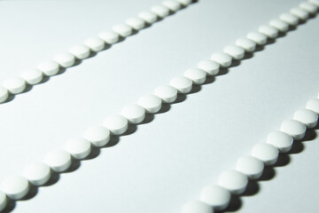 White Melatonin Pills Lined up in a Row