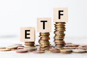 Exchange Traded Fund (ETF) concept. Wooden cube standing with "ETF" text.
