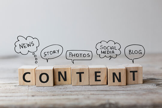 Create Content strategy Concept. Content wording on wooden cubes with speech bubbles.