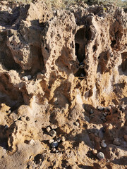 Long frozen lava, porous shore of the Mediterranean Sea.