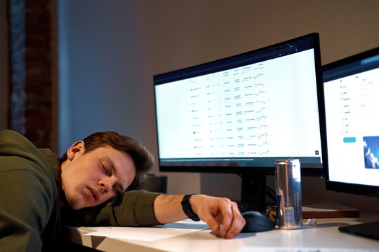 Cropped image of tired male trader sleep at desk