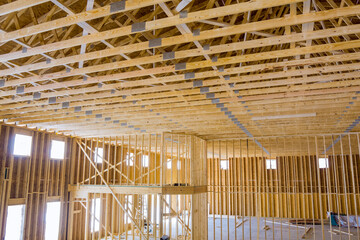 Installation of frame trusses joining with wooden beams at construction