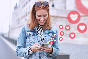 Happy young woman social media messaging with love reactions