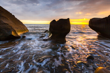 Asia culture - Beautiful landscape of sea level reflect fantasy dramatic sunset sky , the famous travel attractions in Fangshan pingtungcounty, Taiwan. 