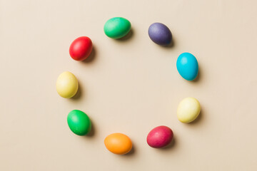 round frame Multi colors Easter eggs on colored background . Pastel color Easter eggs holiday concept with empty space for you design