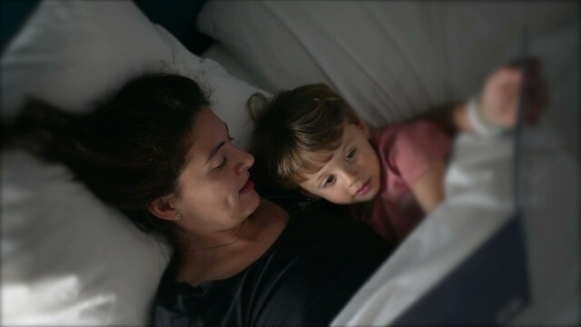 Mother Telling Bedtime Story To Toddler Mom Holding Book Night Routine