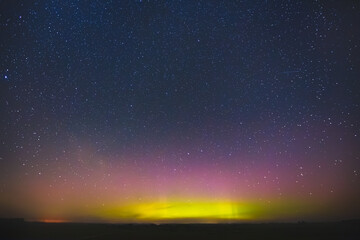 Night sky aesthetics, night sky stars with Aurora borealis in the background, beautiful night view at a roadtrip