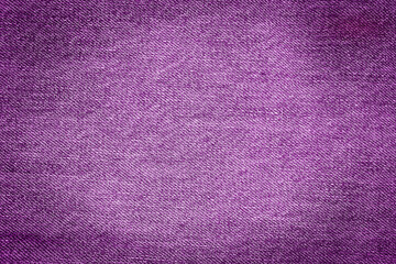 Jeans texture in purple color. Purple background
