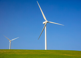 wind turbines, windmill energy on green field