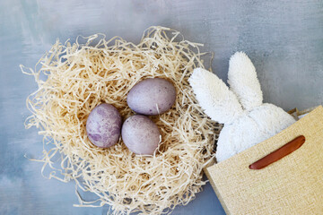 Easter bunny ears sticking out of an Easter egg bag