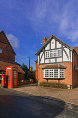 Fototapeta na wymiar England UK. Traditional houses and cottages in an English Village. Suitable for articles on housing market, finance, mortgage, cost of living etc. Generic property image.