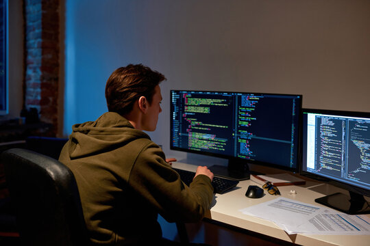 IT developer watching on computer and programming