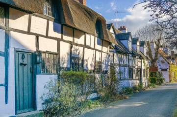 Obraz premium England UK. Traditional houses and cottages in an English Village. Suitable for articles on housing market, finance, mortgage, cost of living etc. Generic property image.