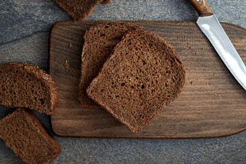 Sliced rye bread on a wooden board