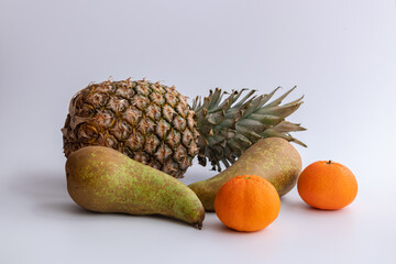 fresh fruits pineapple, pears, tangerines