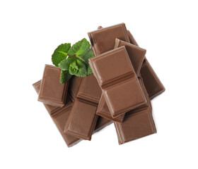 Tasty chocolate pieces and mint on white background, top view