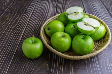 Green apples in a basket
