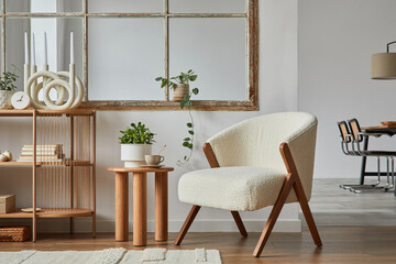 Stylish compositon of modern living room interior with frotte armchair, wooden commode, side table...