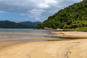 calm beach with mountains around