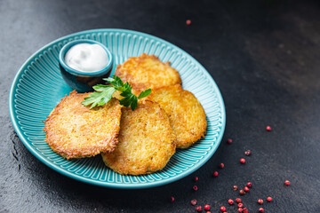 hash brown draniki potato pancakes vegetable fritters second course healthy fresh vegetarian food meal diet snack on the table copy space food background rustic top view