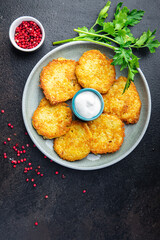 hash brown draniki potato pancakes vegetable fritters second course healthy fresh vegetarian food meal diet snack on the table copy space food background rustic top view