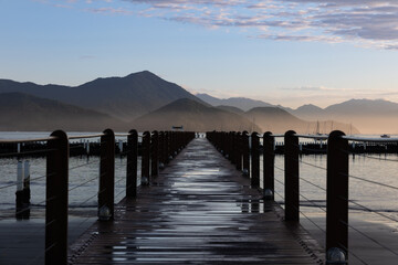 marina deck at dawn with mountains in the background