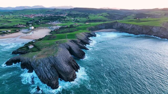 Sunset seen from a drone of the coastal landscape of Punta C&aacute;rcabo near Ajo, between Antuerta beach and Cuberris beach. Cantabrian Sea. Garlic, Cantabria, Spain, Europe