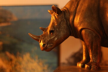 Rhino figurine orange light 