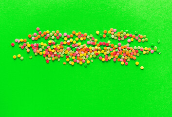 
Background of colorful candies. Rainbow topping for topping ice cream and cakes. Happy Easter!