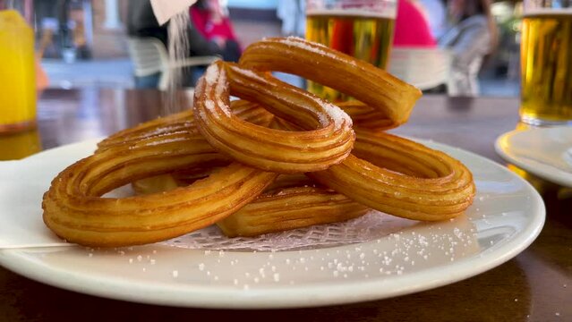 fried churros and sugar