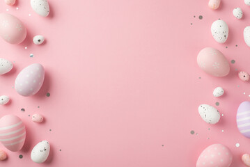 Top view photo of easter decorations shiny confetti violet pink and white easter eggs on isolated pastel pink background with copyspace