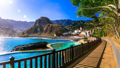 Foto auf Acrylglas Scenic Madeira island, natural swimming pools of charming Porto da Cruz village. Popular tourist resort in Portugal © Freesurf